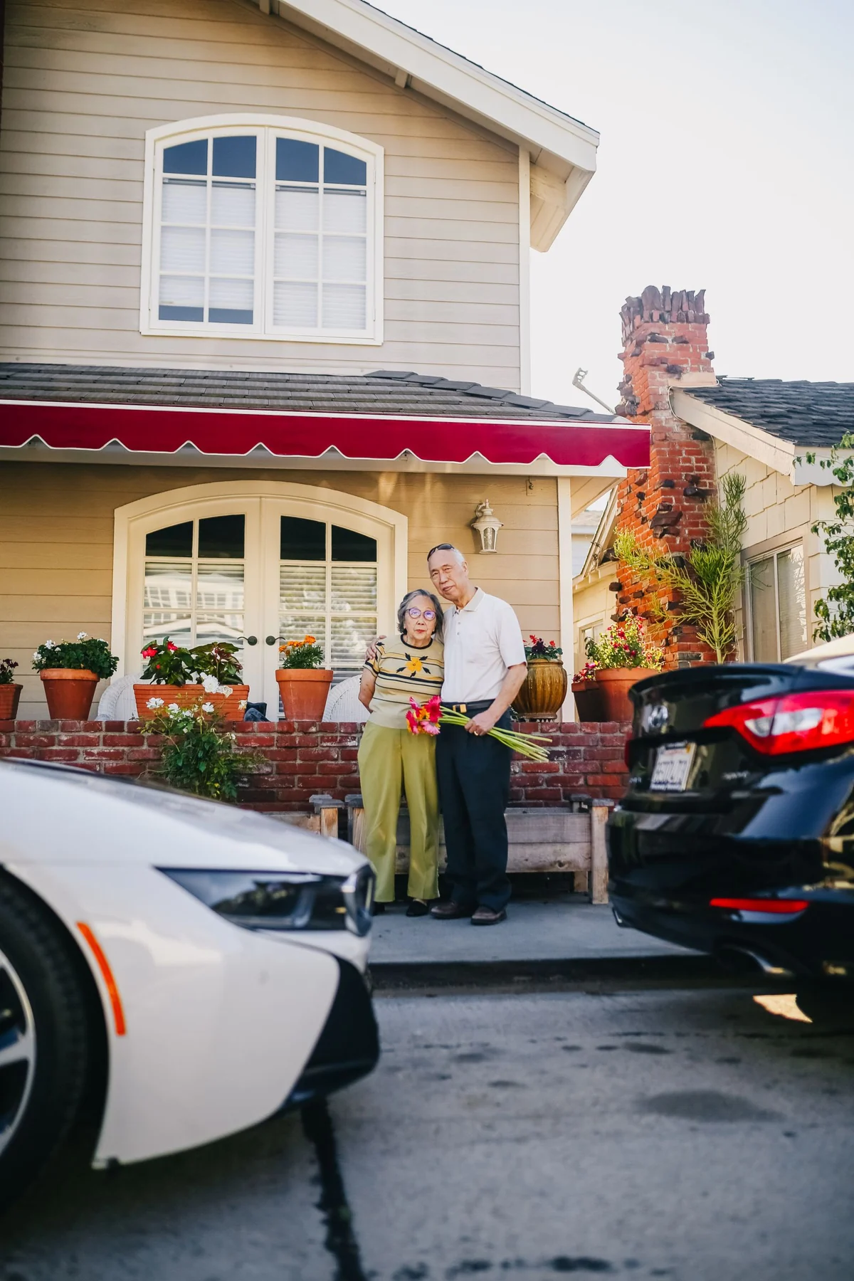 An older couple enjoying time outside their home